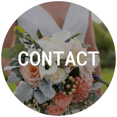 Beautiful bride wearing a white wedding dress holding a light pink and white flowers