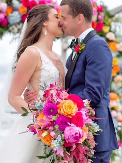 Groom and bride kiss in wedding